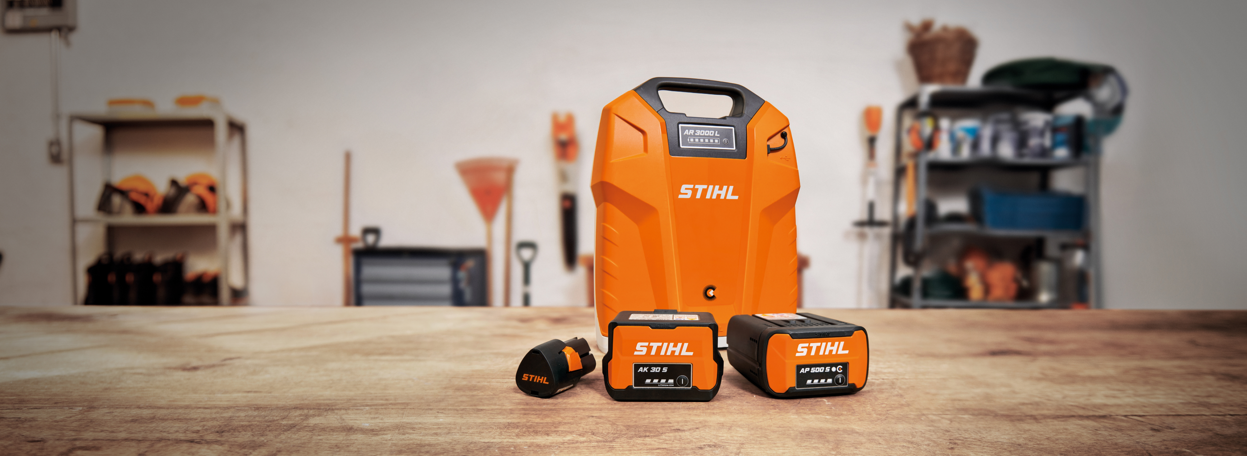 STIHL AP system products lying on a table in a garage