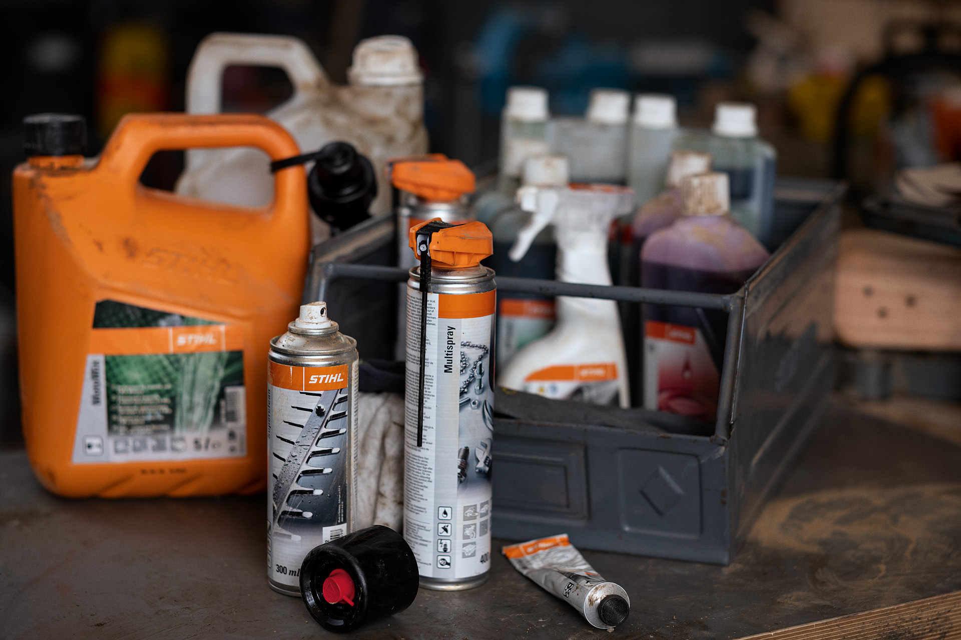 Various fuels and lubricants from STIHL, some in a box 