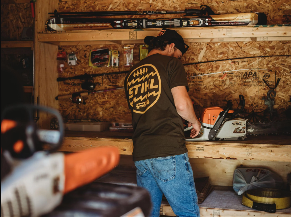 People wearing clothes from the STIHL collections in the forest