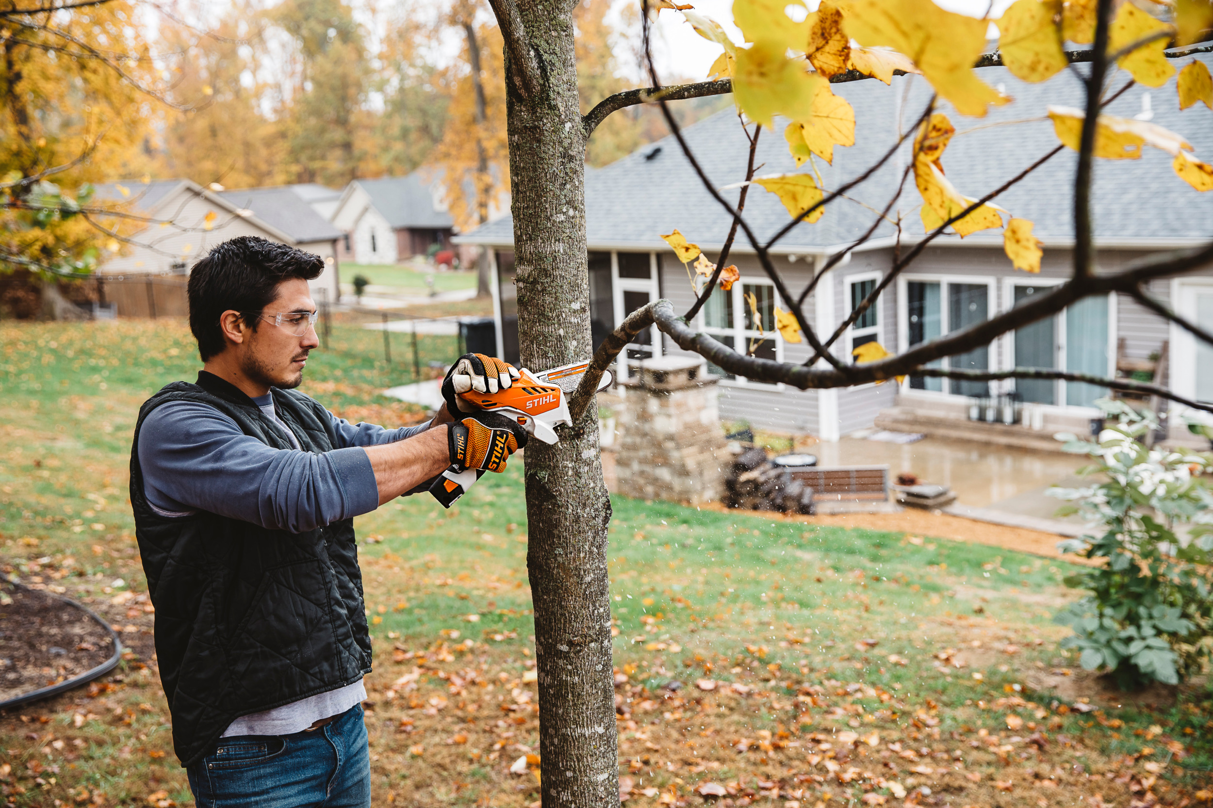 Men operating a GTA 26 to trim a tree